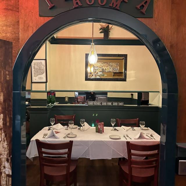 Private dining room with elegant table setting for intimate meetings and events.