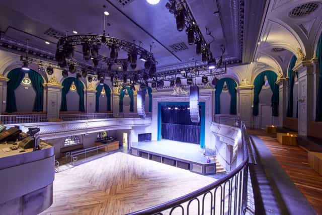 Elegant Green Room in August Hall, perfect for meetings and performances.