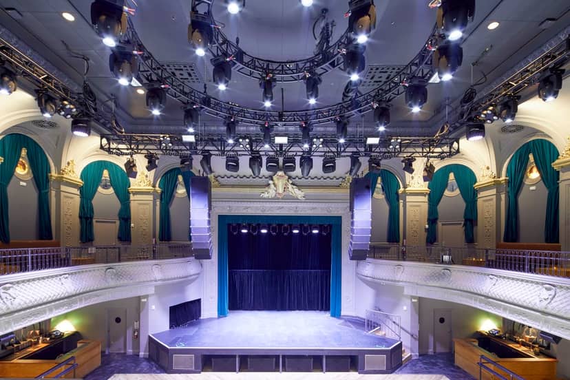 Green Room in August Hall: spacious stage, elegant decor for events and performances.