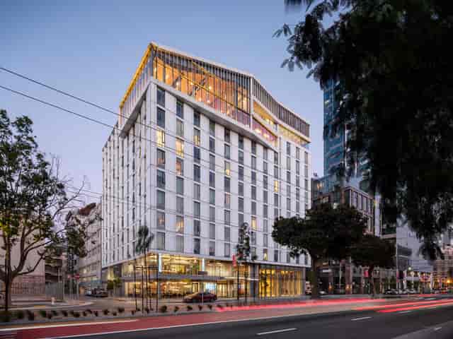 Modern hotel with large windows, perfect for corporate meetings and events.