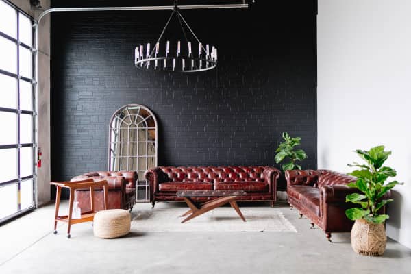 Stylish cocktail lounge with leather sofas, ideal for networking events and meetings.