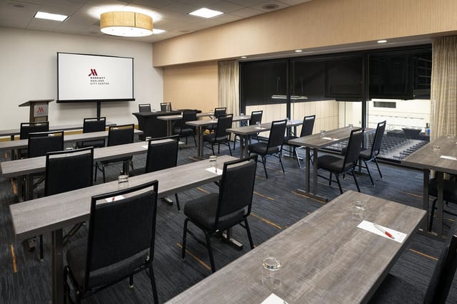 "Suite 105 at OCC Conference Center: bright meeting room for workshops and presentations."