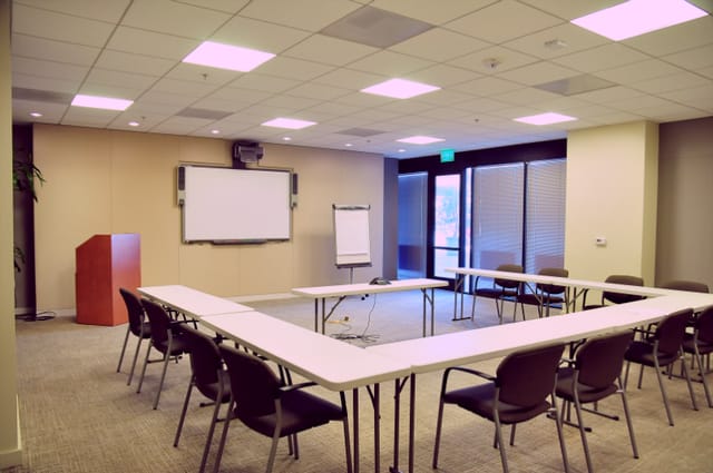 OCC Conference Center Suite 105, U-shaped meeting room for workshops and planning sessions.