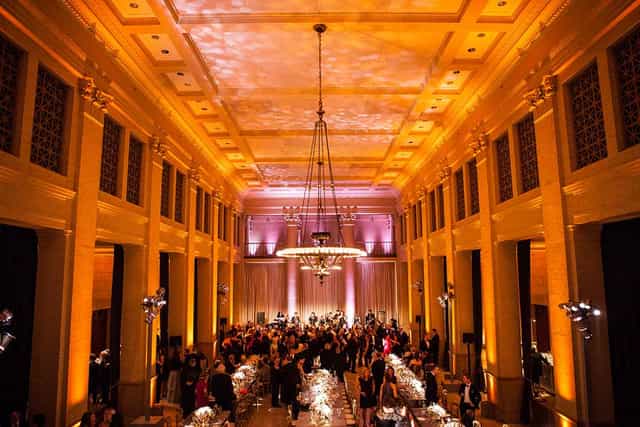 Elegant event venue in THE CENTER SF with warm amber lighting for corporate gatherings.