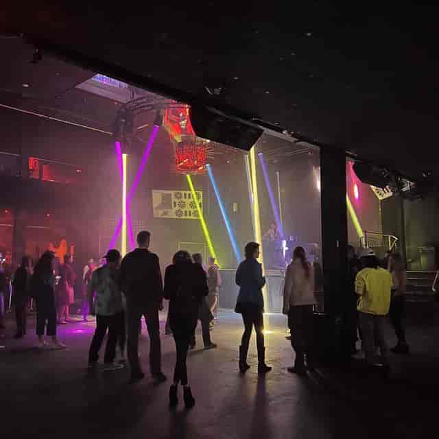 Vibrant event space at Power Exchange with dynamic lighting for social gatherings.
