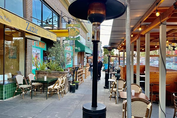Heated garden patio in Zazie, perfect for casual meetings and outdoor events.