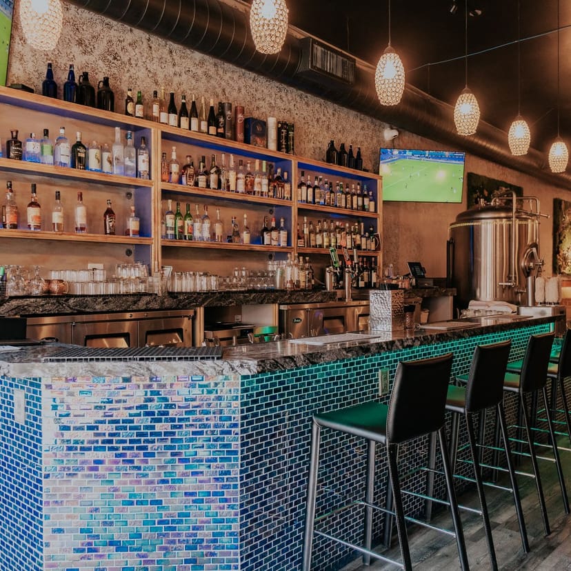 Stylish bar at Castro Indian Restaurant, perfect for networking and sports events.