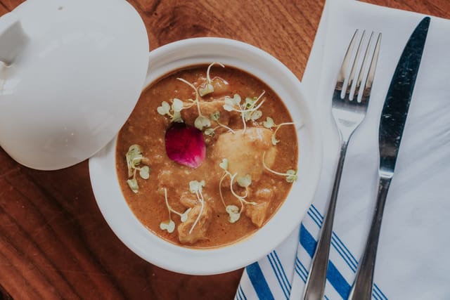 Elegant dish with flower garnish at Castro Indian Restaurant & Bar for events.