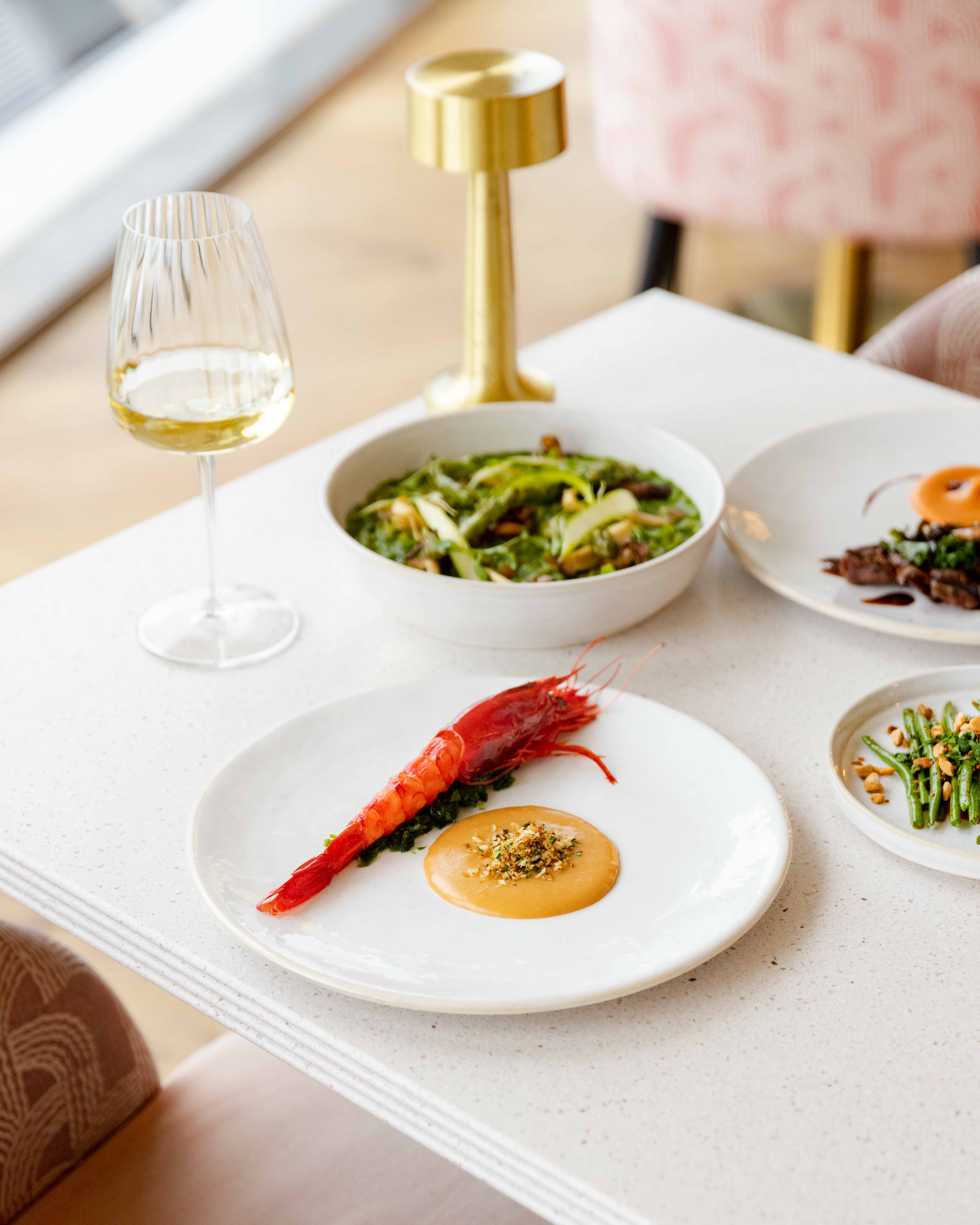 Elegant dining setup at JOIA Restaurant, perfect for high-end events and networking. - Banner