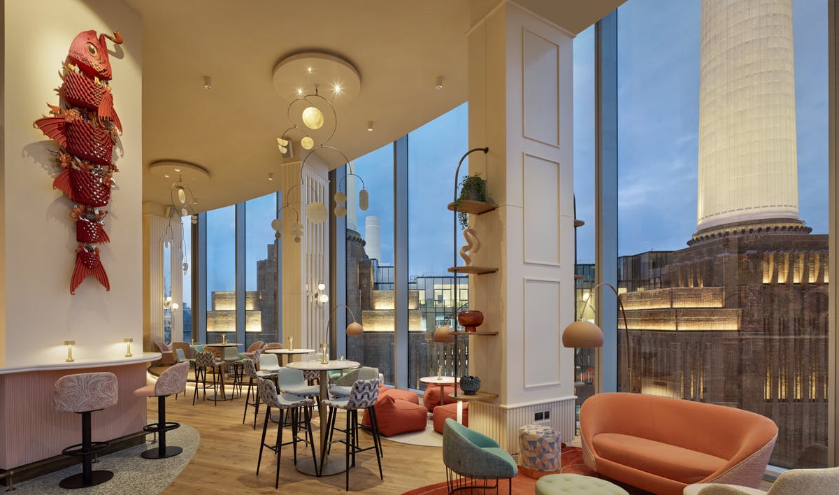 Stylish JOIA Restaurant event space with large windows, ideal for networking and receptions.