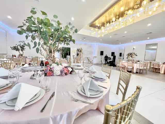 Elegant banquet hall with gold decor, ideal for weddings and corporate events.
