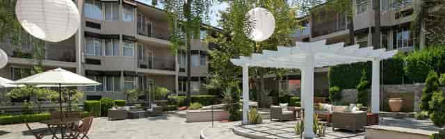 Outdoor event space at Second Story Restaurant with pergola and seating for gatherings.