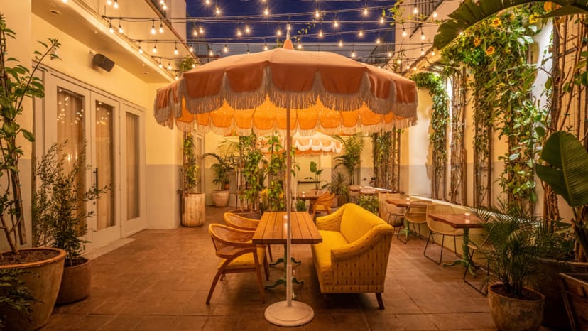 Outdoor patio with string lights, ideal for intimate gatherings and events.