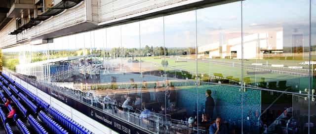 Modern event space at Kempton Park Racecourse with panoramic views for corporate meetings.