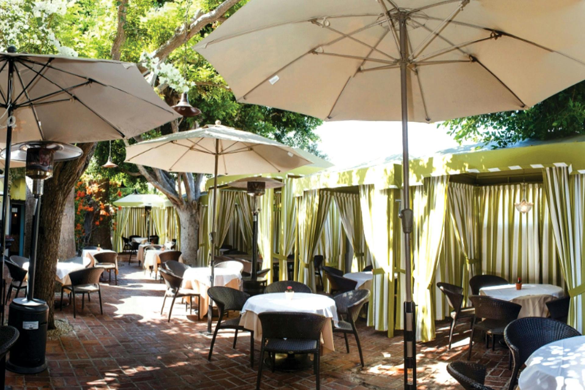 Outdoor banquet facilities with shaded tables for events at Ca' Del Sole Ristorante Italiano.
