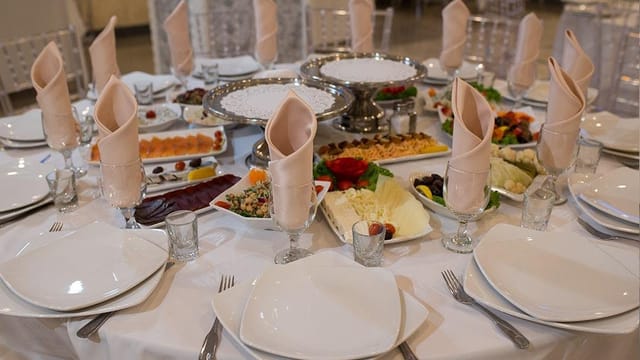 Elegant banquet table setup at Amour Banquet Hall for events and celebrations.