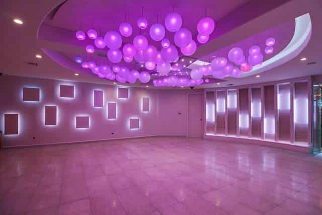 Modern Mirage Conference Room with vibrant purple decor for events and gatherings.