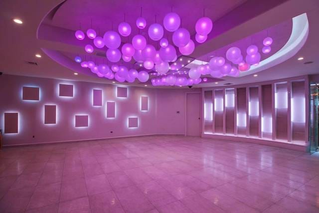 Modern Mirage Conference Room with vibrant purple decor for events and gatherings.