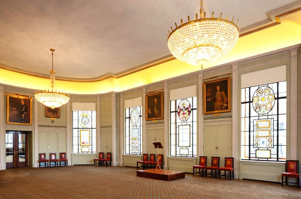 Elegant Trinity House library with stained glass, ideal for formal events and conferences.