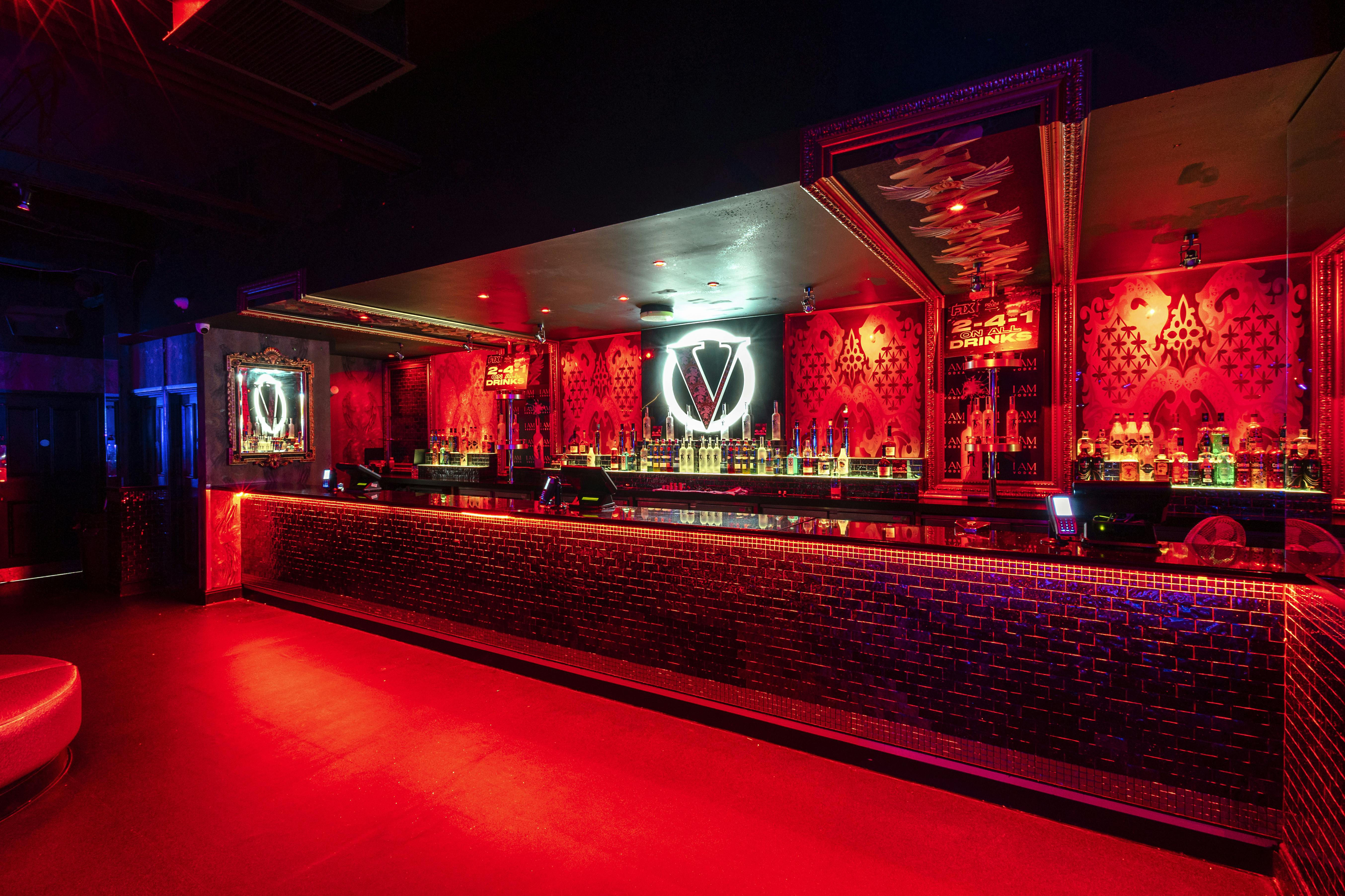 Vibrant PRYZM Bristol bar with red lighting, ideal for upscale events and after-parties.