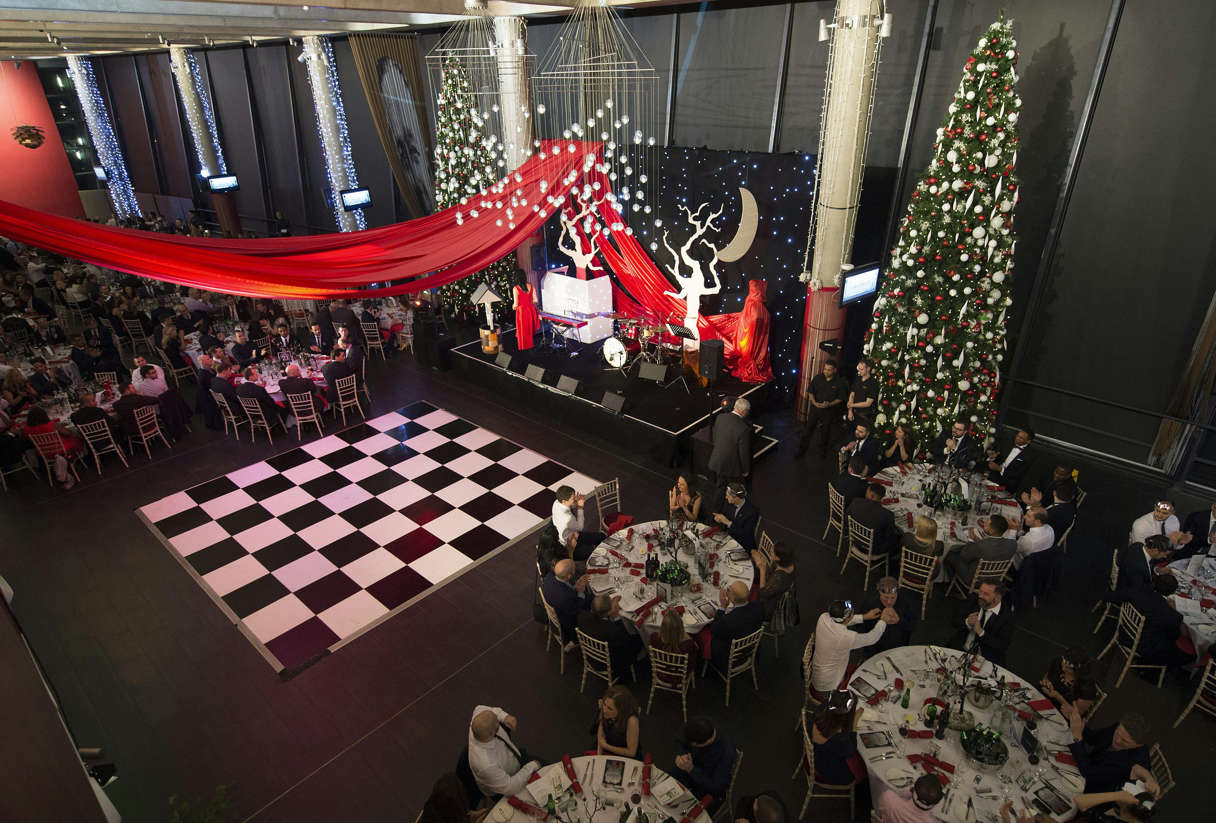 Christmas event at Arsenal FC with elegant tables and festive decor.