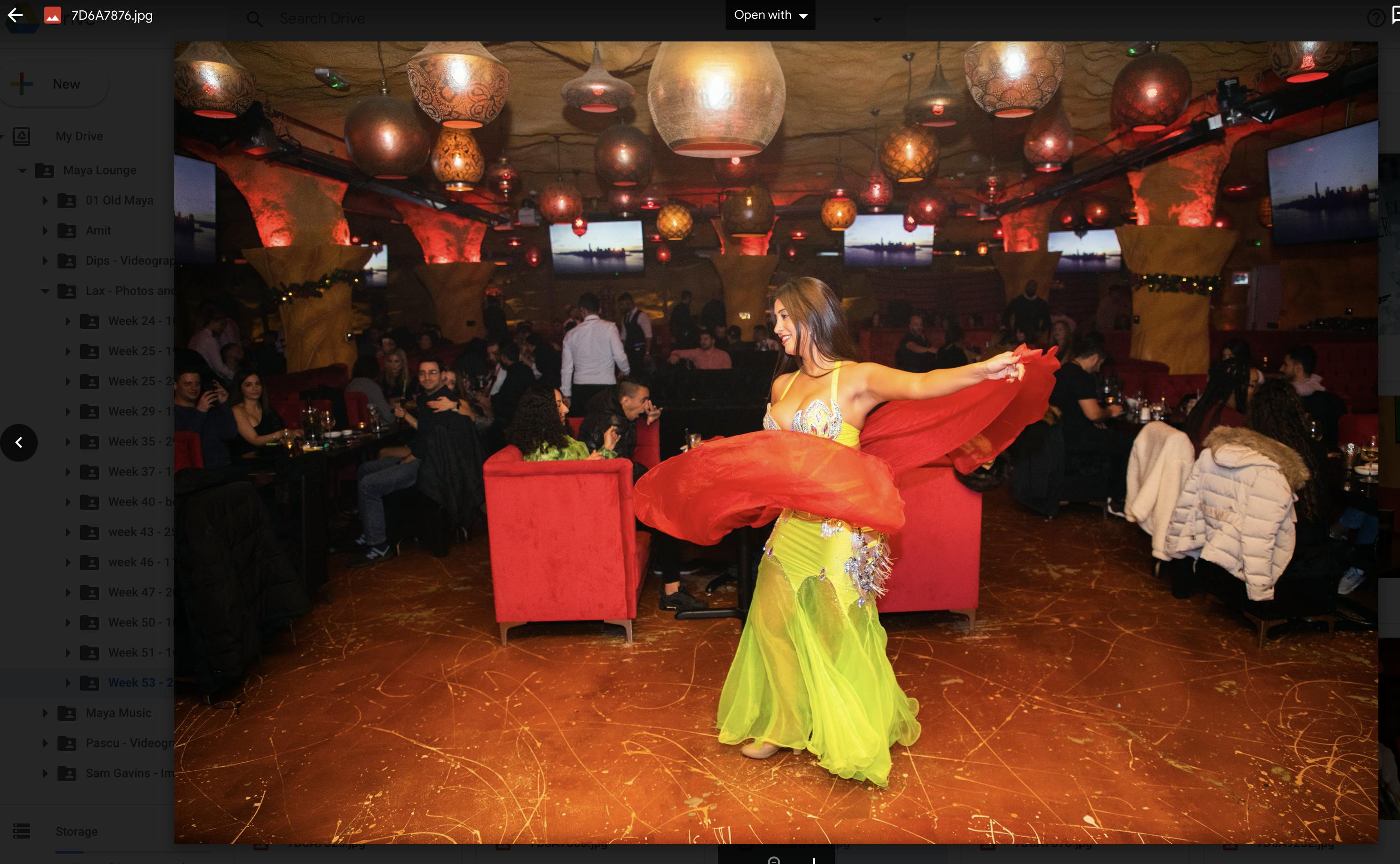 Vibrant Maya Lounge bar with colorful dancer, perfect for themed events and gatherings.
