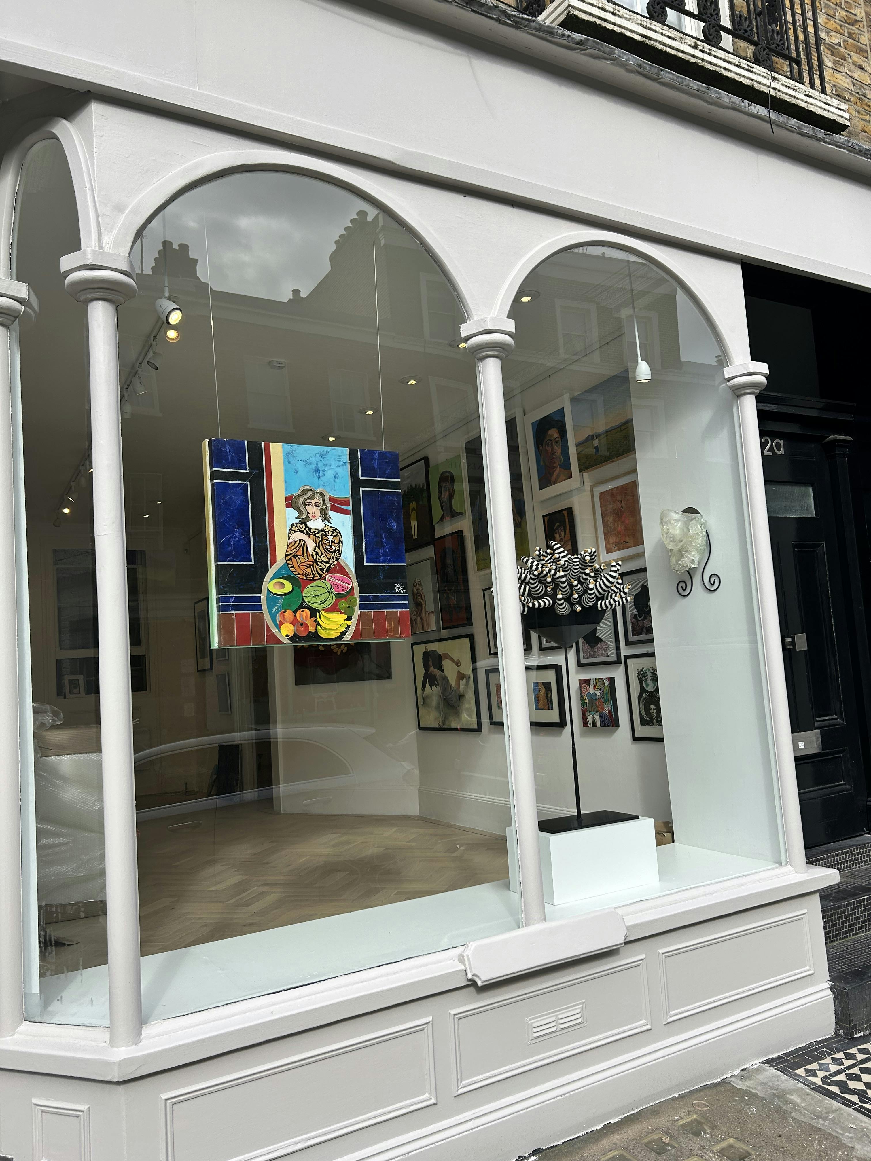 Vibrant art gallery space with colorful artwork, ideal for events and exhibitions.
