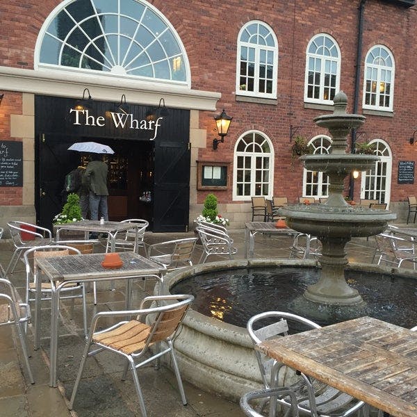 Upstairs Bar at The Wharf: charming venue with outdoor seating for events and gatherings.