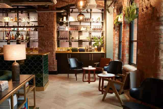 Stylish lounge in LEVEN Hotel Manchester for informal meetings and networking events.