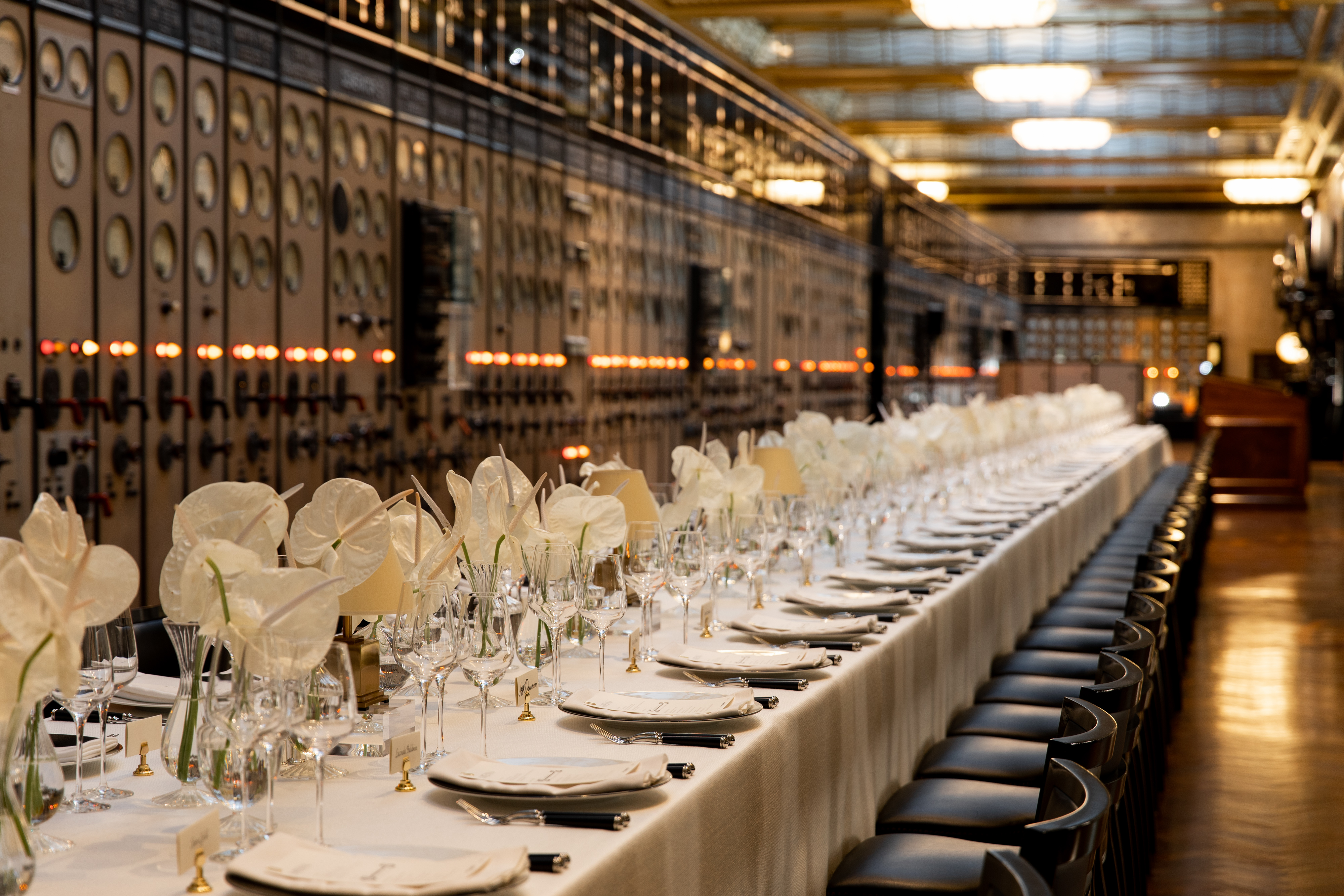 Elegant dining setup in Battersea Power Station's Control Room A for corporate events. - Banner