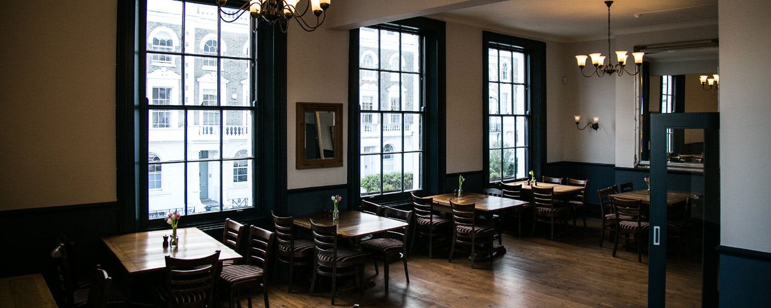 Spacious Gloucester Room at The Lansdowne, ideal for meetings and events.