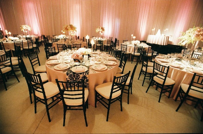 Chiavari chairs in elegant banquet hall for upscale weddings and corporate events.