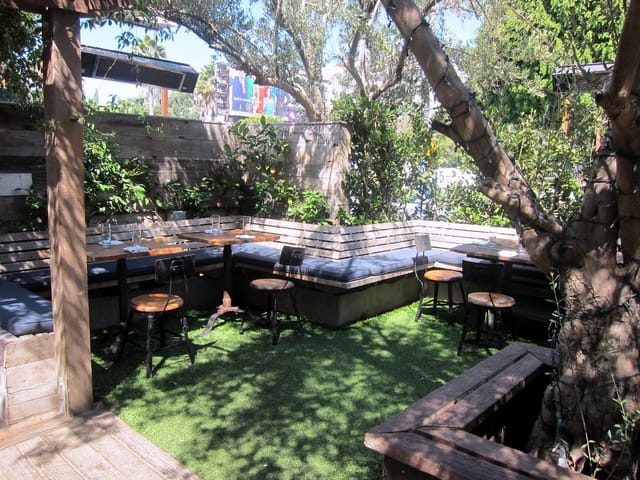Cozy outdoor event space at The Eveleigh with greenery for intimate gatherings.