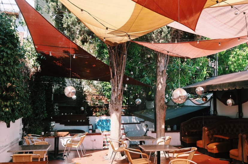 Vibrant outdoor event space with colorful canopies for gatherings and meetings.