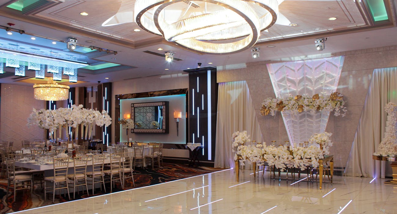 Grand Ballroom at Bellaj Banquet Hall with elegant chandeliers, perfect for weddings and events.