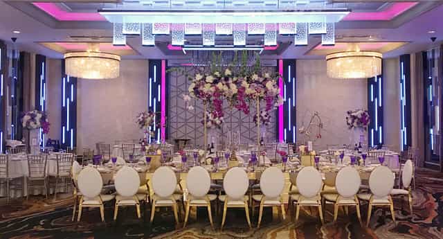 Elegant Grand Ballroom with banquet table, ideal for upscale weddings and events.