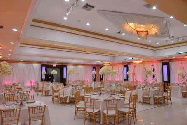 Opulent ballroom with elegant tables, ideal for weddings and formal events.