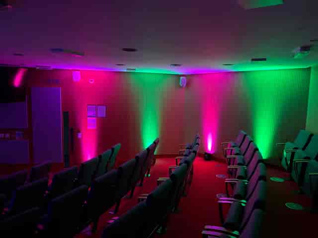 Churchill House lecture theatre with vibrant LED lighting for corporate events and conferences.