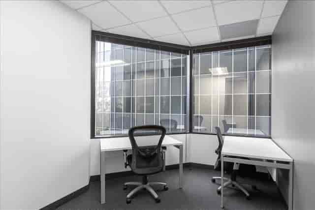 Minimalist meeting space with large windows for team discussions at Suite #200, 303 N Glenoaks.