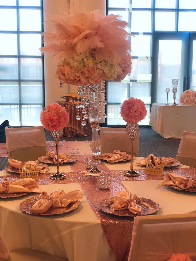 Sweet 16 event at The Mayne Events Center with elegant pink floral centerpiece.