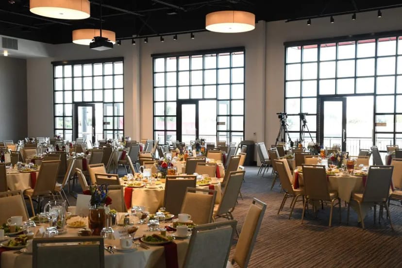 Sweet 16 event space with elegant tables, ideal for formal gatherings and banquets.