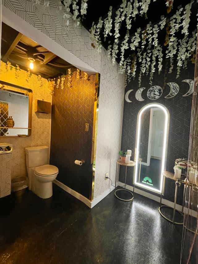 Stylish event restroom with modern decor and elegant lighting at Golden Occasions Venue.