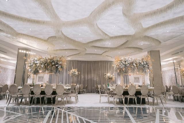 Elegant event venue with textured ceiling, perfect for weddings and corporate events.