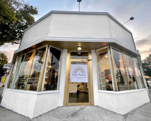 Golden Occasions event venue with large windows, ideal for meetings and social gatherings.