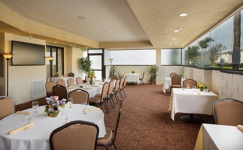 Coast Anabelle Hotel event space with round tables, ideal for corporate meetings and social events.