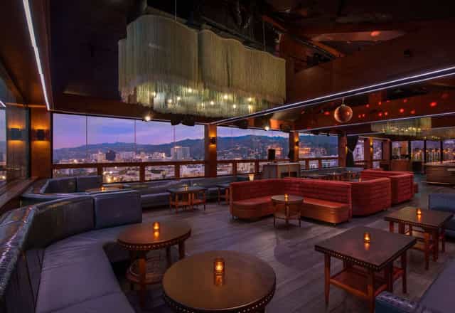 Stylish rooftop meeting room in Hollywood Hotel with panoramic city views for upscale events.