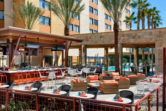 Media Lounge at Los Angeles Marriott Burbank, vibrant outdoor event space with pool.