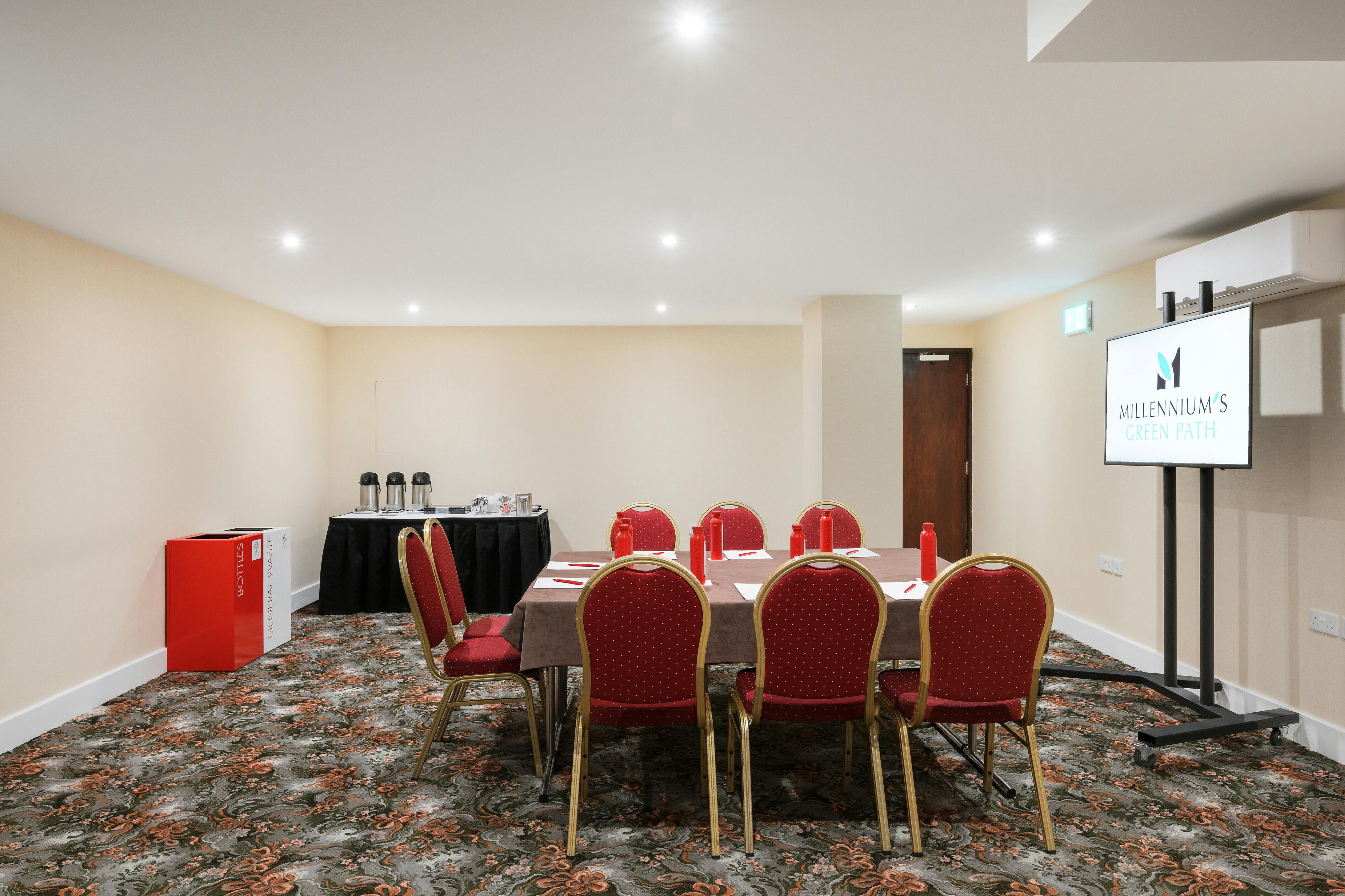 Windsor Suite meeting room with red chairs, ideal for workshops and corporate events.