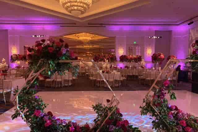 Elegant wedding venue at Sheraton Universal with floral decor and ambient lighting.