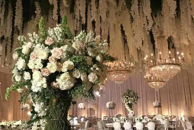 Elegant wedding venue at Sheraton Universal with floral arrangements and chandeliers.